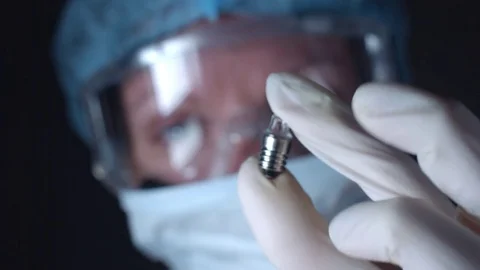 4K Close-Up Lab Scientist with a Light Bulb Video stock 73054023