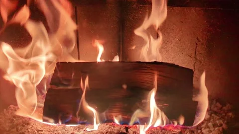 4K Close Up of Log Burning in Fireplace, Intense Flames and Embers, Cozy Ind Stock Footage 341746805