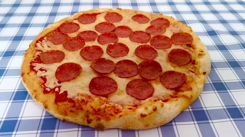 4K close-up macro view of fresh crispy cheesy pepperoni pizza golden crust .. Stockbeeldmateriaal 318251646