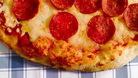 4K close-up macro view of fresh crispy cheesy pepperoni pizza golden crust .. Stock Footage 318251947