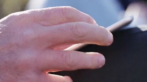 4K Close up of male hands using a tablet device, in slow motion Stock Footage 69247608