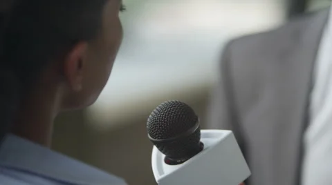4K Close up of man giving interview to news reporter. Stock Footage 56582961