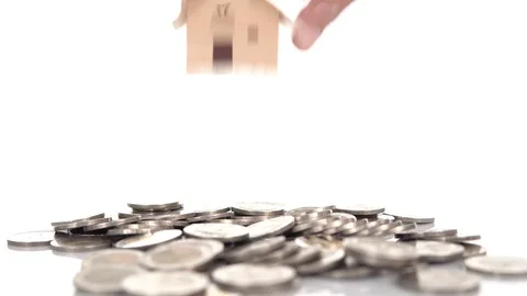 4k close up mini house on a group of coin Stock Footage 115103253