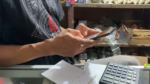 4K Close Up of Mobile Payment Transaction in Small Local Shop Stock Footage 330001946