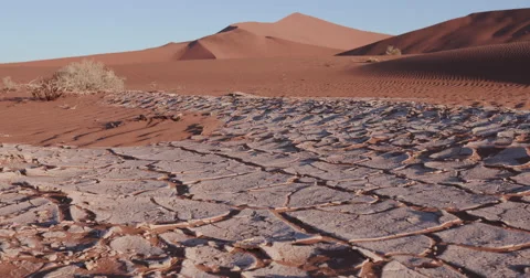 4K close-up moving shot of dried cracked mud Stock Footage 64710849