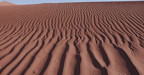 4K close-up moving shot of ripples in the surface of a sand dune Stock Footage 64696561