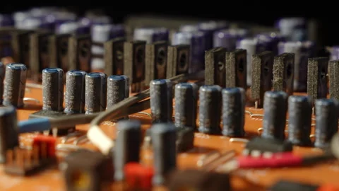 4K Close-up PCB - Power Transistor &amp; Capacitor Parade - Rotating - Shallow DOF Stock Footage 331170830