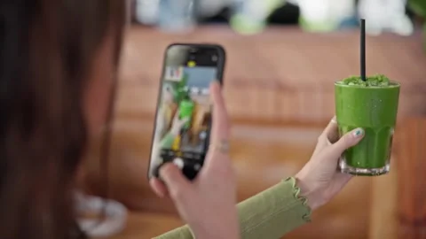 4K Close-up Person Using Smartphone Video Green Juice Smoothie Drink Stock-Footage 330480737
