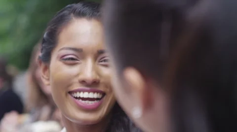 4K Close up portrait 2 beautiful female friends chatting outdoors in the city Stock Footage 55955124