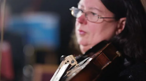 4K Close up portrait classical violinist during orchestra performance Stock Footage 68704348