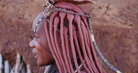 4K close-up portrait view of a pretty Himba girl showing head gear and neck Stock Footage 95211626