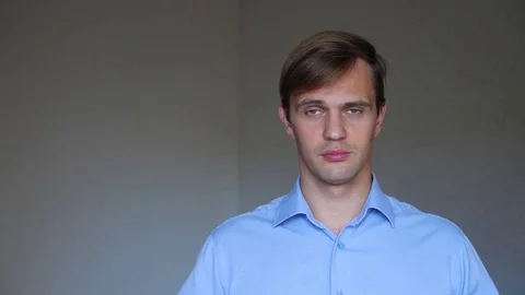 4k. Close up . portrait of a young man. body language and gestures. he closes Stock Footage 81558705