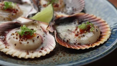4K Close-up Prepared Scallops Served in Natural Shells Green Onion Stock-Footage 330480797