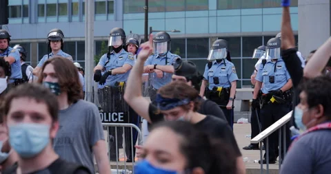 4K CLOSE UP OF PROTESTORS TURNING WITH THEIR FISTS IN THE AIR Stock Footage 131458849