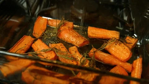 4K Close-up Roasted Carrots or Sweet Potatoes Fresh Rosemary and Herbs Stock Footage 330480838