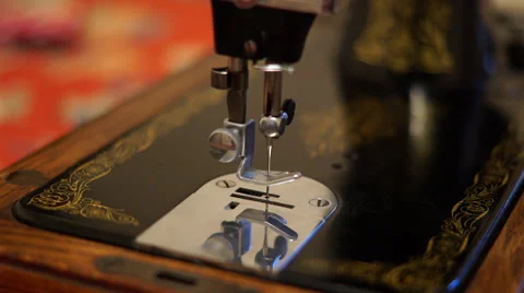 4K Close up shot of empty vintage sewing machine needle moving up and down Stock Footage 59730315