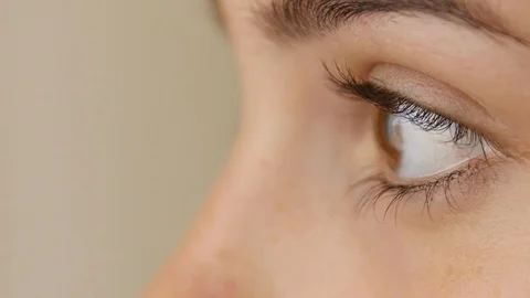 4K close up shot of female blinking eyes. The shot from side Stock-Footage 102496792