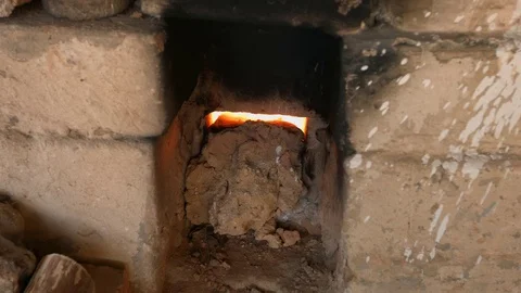 4K close-up shot that A flame and smoke is coming out of a porcelain kiln brick. Stock Footage 76486428
