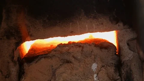 4K close-up shot that A flame and smoke is coming out of a porcelain kiln brick. Stock Footage 76486515