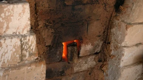 4K close-up shot that A flame and smoke is coming out of a porcelain kiln brick. Stock Footage 76539361