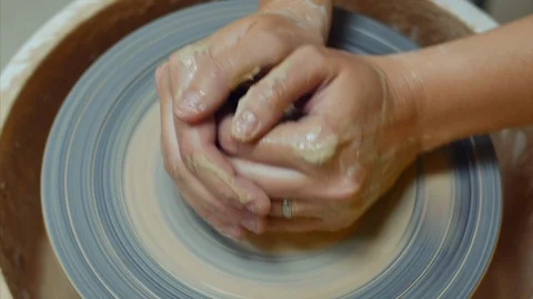 4k Close up shot of hands holding and forming the pot on the potter's wheel Stock-Footage 102465045