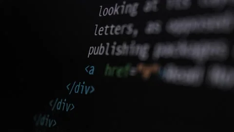 4K Close-up shot HTML tag code on PC Monitor scroll down. Background Stock Footage 219465360