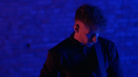 4K The close up shot of a man playing guitar Stock-Footage 102865813