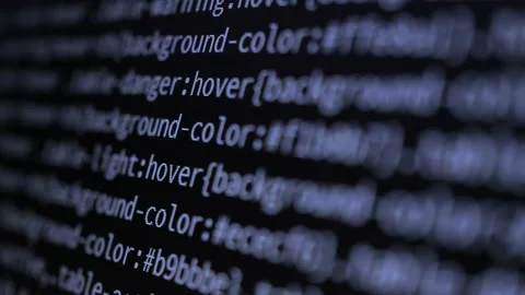 4K Close-up shot programming tag code on PC Monitor scroll down. Stock Footage 219465314