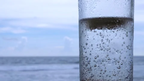 4K Close Up Soda Bubbles Sparkling Drink Ocean Background Waves Stock Footage 287209033