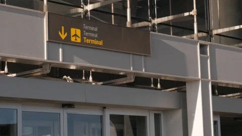 4k close up static shot of a airplanes terminal direction sign at an airport Stock Footage 123831738