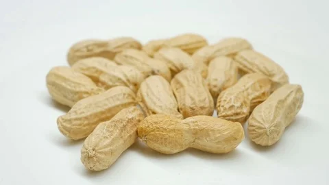 4k, Close-up studio shot footage of peanuts rotates in center side Stock Footage 82632672