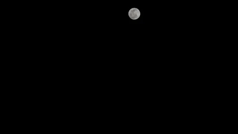 4k close-up time lapse of a disappearing full moon moving in black sky Stock Footage 146226491