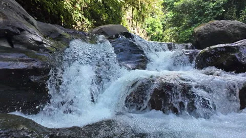 4K Close Up Tracking Left Of Water Flowing Over Waterfall In Rainforest River Stock Footage 285871805