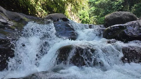 4K Close Up Tracking Right Of Water Flowing Over Waterfall In Rainforest River Stock Footage 285871880