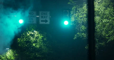4K CLOSE UP TRAFFIC LIGHT AT NIGHT WITH STEAM OR SMOKE Stock Footage 131109248