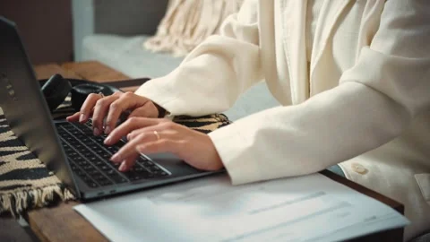 4K close-up video of an anonymous woman's hands using a laptop keyboard. Technol Stock Footage 346713858
