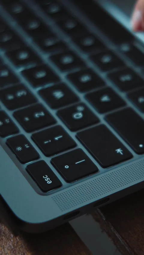 4K close-up video of an anonymous woman's hands pressing the Esc key on a laptop Stock Footage 346713919