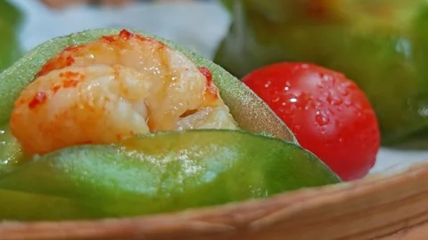 4K A close-up video of a beautifully presented dish being served in a Stock-Footage 338235773