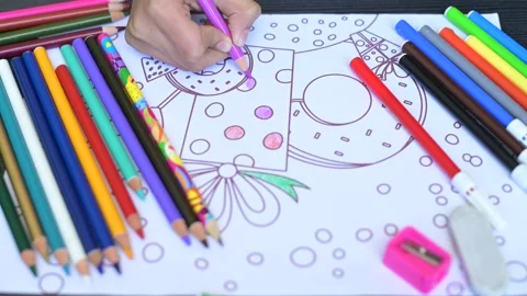4K close-up video of a school kid coloring in Covid pandemic home learning Stock Footage 146226503