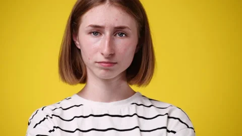4k close-up video of upset offended woman isolated over yellow background. Stock Footage 219403151