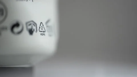 4k Close view of 5 HDPE recycling sign or label and others on white packaging Stock Footage 195091657