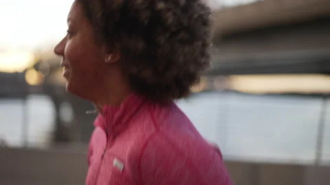 4k Close view of female runner runs and trains on bridge in city spbas. Stock Footage 219898216