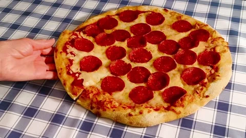 4K close-up view of holding and picking up a slice of fresh crispy cheesy p.. Video stock 318251048