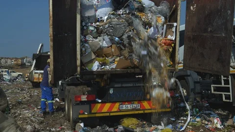 4K close-up view of pockets of vegetables along with other trash being dumped at Stock Footage 104705036