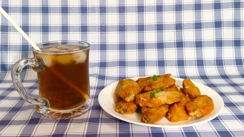 4k Close up view. Straw stirring drink into glass cup with ice cubes served.. Stock Footage 318252719