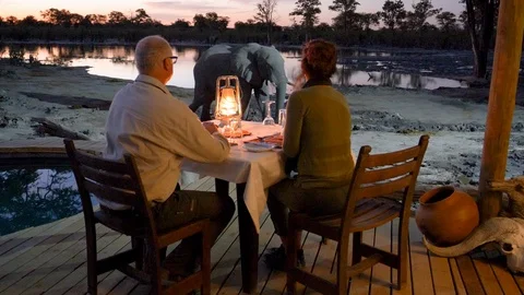 4K close-up view of tourists sitting at the dinner table at sunset on the Stock Footage 95209130