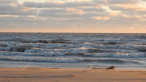 4K Close Up Waves Crashing On Beach On Windy Cloudy Day Near Sunset Stock Footage 89110333