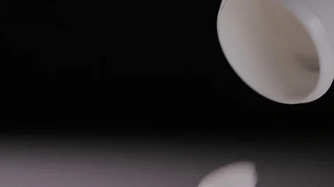 4K Close up of white tablets falling from a pill bottle - with space for text Stock Footage 70373413