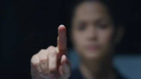 4K Close up woman using interactive touch screen on black background Stock Footage 64047683