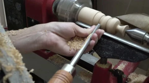 4K close up of a woman's hands making wooden ecological toys on a lather Stock Footage 139646022